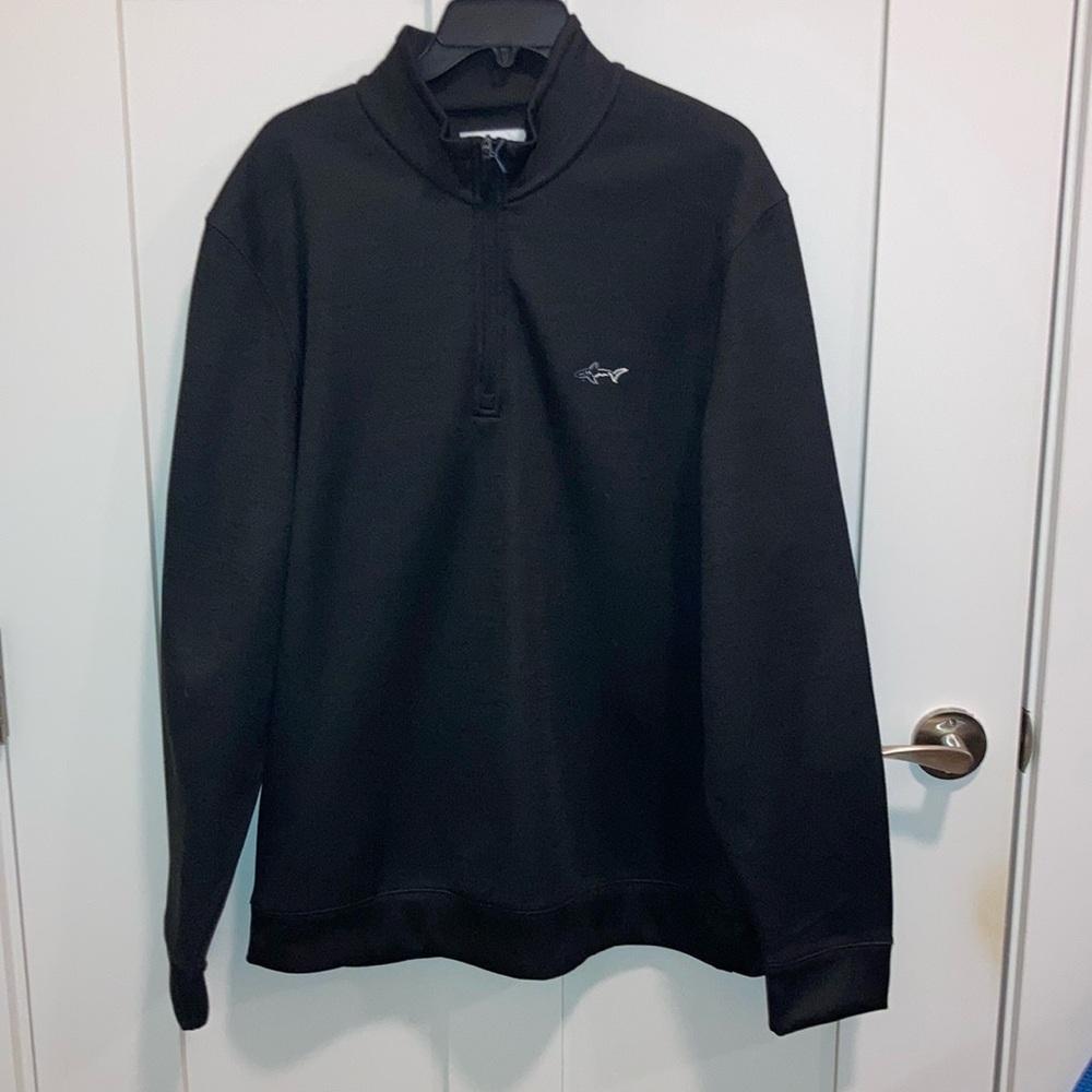 Men’s black 1/4 front zip with collar. Lightweight and stretch. Attack Life.